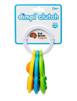 Dimpl Clutch by Fat Brain Toy Co. is a colorful sensory toy designed for infants. It features a ring with various textured buttons in vibrant colors, promoting tactile exploration and fine motor skills development. The product is made from BPA-free materials and is suitable for ages 0 months and up.