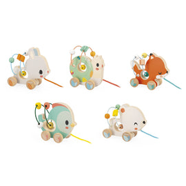 A colorful assortment of five wooden animal pull toys by Janod, featuring a rabbit, a bear, a chick, a fox, and a turtle. Each toy is designed with playful, friendly faces and includes a string for pulling.