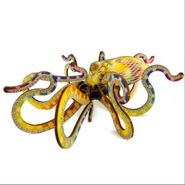 A colorful DIY kit featuring a 3D octopus model made from intricately designed pieces. The octopus showcases vibrant patterns and textures, with flowing tentacles and a detailed body. Perfect for crafting enthusiasts and ocean lovers alike.