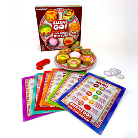 The product 'Spin Some for Dim Sum' by Gamewright features a colorful game box with images of cute food items. In front of the box is a circular platter with various dim sum pieces and several colorful menu cards spread out, showcasing different food items and instructions for gameplay.