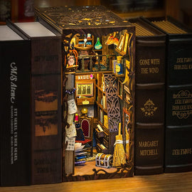 The Magic Pharmacist DIY Book Nook is a creatively designed miniature scene showcasing a magical pharmacist's shop. The intricate details include shelves filled with potions, ancient books, a cozy chair, and charming decor, all enclosed within a beautifully crafted book-like structure.