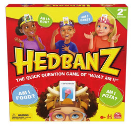 Hedbanz 2nd Edition game box featuring colorful graphics. The box shows children wearing headbands with question prompts like 'Am I a dog?' and 'Am I food?'. Exciting game for ages 6 and up, designed for 2 to 6 players, promoting fun and laughter.