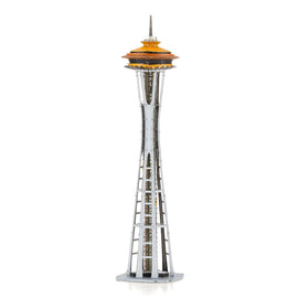 A detailed model of the iconic Space Needle, originally showcased at the 1962 World's Fair in Seattle. The structure features a sleek silver base with an orange-topped observation deck, showcasing intricate design elements.