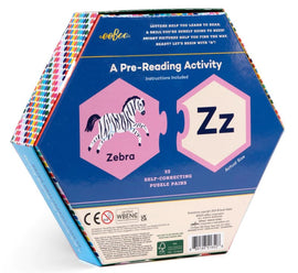 The Alphabet Puzzle Pairs by Eeboo features a hexagon-shaped box illustrated with a zebra and the letter 'Z'. It includes 33 self-correcting puzzle pairs designed as a pre-reading activity to aid children in letter recognition and early reading skills. The vibrant packaging attracts young learners, emphasizing fun and education.