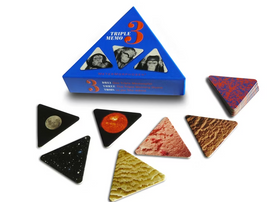 A colorful triangular box labeled 'Triple Memo' by MeterMorphosen, featuring three images of monkeys on the front. Surrounding the box are various triangular memory cards showcasing celestial and planetary images, including the Earth, moon, sun, and textures resembling extraterrestrial surfaces. The game promises engaging gameplay and cognitive challenges.