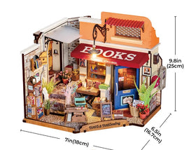A beautifully detailed DIY kit titled 'Corner Bookstore' by Robotime, featuring an intricately designed miniature bookstore scene. The model showcases a cozy shopfront with a red awning labeled 'BOOKS', surrounded by shelves filled with books, potted plants, and decorative items. The interior includes a small table, artwork on the walls, and a charming open sign at the door. Perfect for crafting enthusiasts who enjoy building miniature models.