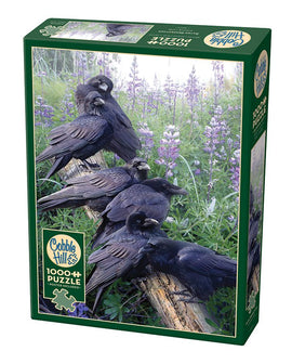 A Cobble Hill jigsaw puzzle titled 'Raven Rendezvous', featuring a captivating scene of ravens perched on a log surrounded by vibrant purple flowers. The puzzle includes 1000 pieces and a poster is included as a bonus, making it perfect for puzzle enthusiasts who appreciate nature and wildlife photography.