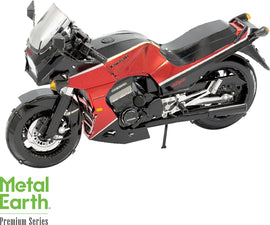 A detailed DIY model kit of the Kawasaki GPz900R motorcycle by Fascinations. The model features vibrant red and black colors, intricate metal parts, and realistic details, showcasing its aerodynamic design and iconic shape, perfect for collectors and enthusiasts.