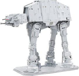 The ICONX Imperial AT-AT by Fascinations is a detailed DIY kit featuring a metallic structure with intricate details. The iconic All Terrain Armored Transport is depicted in a standing position, showcasing its iconic legs, cockpit, and weapons. The model features a sleek gray finish and is displayed on a flat base, perfect for collectors and Star Wars fans.