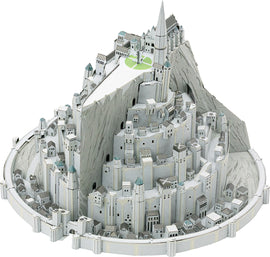 A detailed DIY model kit of Minas Tirith from the Lord of the Rings, showcasing its intricate architecture, layered cityscape, and iconic towers, all designed for assembly. The model features grey and white tones with accented rooftops, nestled against a mountainous backdrop.