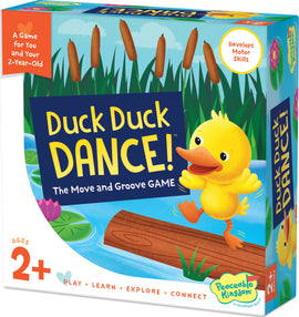 The colorful packaging of the game 'Duck Duck DANCE!' by Peaceable Kingdom. The box features a cheerful yellow duck dancing on a log, surrounded by vibrant green grass and cattails. The product promotes motor skills development for toddlers aged 2 and up.