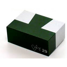 The Aluminum Dovetail T by W.G.H. Strijbos is a mechanical puzzle featuring a sleek, compact design. The box is primarily green with a white top featuring a distinctive cross shape, indicative of its clever construction. Perfect for puzzle enthusiasts looking for a challenging and engaging experience.