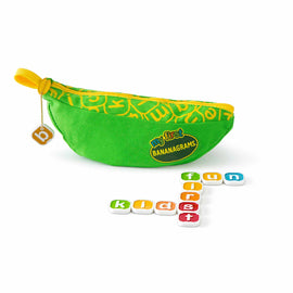 A colorful green pouch in the shape of a banana labeled 'My First Bananagrams' from Bananagrams. The pouch is unzipped, revealing several letter tiles arranged to spell 'fun', 'first', and 'kids'. The pouch features a bright yellow zipper and a playful design, making it appealing for children and families.