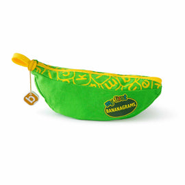 A vibrant green fabric pouch shaped like a banana, with a yellow zipper and bright yellow lettering. The patch on the front reads 'my first BANANAGRAMS', designed for children's word games, emphasizing educational play.