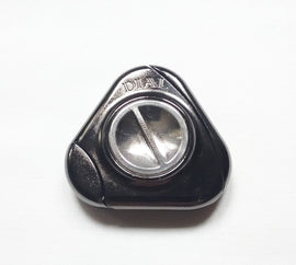 Close-up of the Hanayama Cast Dial mechanical puzzle featuring a shiny silver exterior shaped like a triangular dial. The surface reflects light, highlighting its sleek design.