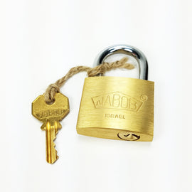 B-Lock by Puzzlocks featuring a gold padlock with a shiny chrome shackle. Includes a key attached with jute twine, ideal for puzzle lovers and collectors.