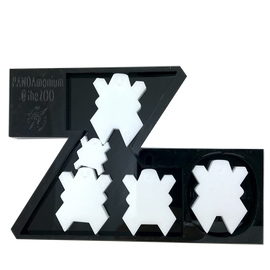 A mechanical puzzle featuring a whimsical design with several panda-shaped pieces arranged within a stylized letter 'Z'. The black base is engraved with 'PANDAmonium @ the ZOO', showcasing a playful and interactive way to engage with the San Diego Zoo theme.