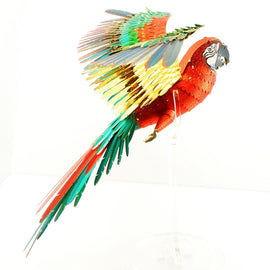 A beautifully crafted 3D model of a macaw parrot. The model is vibrantly colored with shades of red, green, and yellow, showcasing intricate details in its wings and feathers. It stands on a clear base, giving the impression of flight. Perfect for DIY enthusiasts and bird lovers alike.