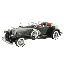 A detailed metal model of a 1935 Duesenberg M, showcasing intricate design elements such as the spoked wheels, sleek lines of the body, and a classic convertible top. The model exhibits a polished black finish with red accents inside, perfect for collectors or as a DIY project.