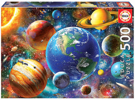 Educa Solar System jigsaw puzzle featuring a vibrant illustration of planets, stars, and cosmic elements. The puzzle contains 500 pieces, showcasing detailed artwork of the Earth, Mars, Saturn, and more against a colorful celestial background.