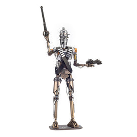 Metal Earth ICONX IG-11 figure made from metal parts, depicting a tall robotic character holding a weapon in one hand, standing on a base.