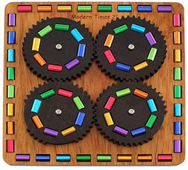 The Modern Times 21 mechanical puzzle designed by Jean-Claude Constantin. It features a wooden base with colorful, rotating gears arranged in a circular pattern, showcasing vibrant shapes and colors. This intricate puzzle offers an engaging challenge for puzzle enthusiasts of all ages.