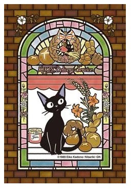 Jiji Puzzle featuring a stained glass window design from Kiki's Delivery Service, depicting Jiji the black cat with bakery items and flowers, beautifully colored in bright hues, perfect for puzzle enthusiasts.
