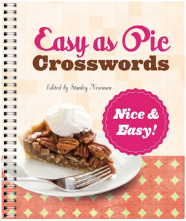 Cover of the 'Nice & Easy! Easy as Pie Crosswords' book edited by Stanley Newman. Features an image of a slice of pecan pie topped with whipped cream on a plate, with a fork beside it. The background has a quilt-like pattern with soft colors, enhancing the inviting theme of easy crossword puzzles.