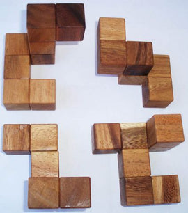 Coffin's Four-Piece Cube by Bill Sheckles is a mechanical puzzle featuring four distinct wooden shapes that can be combined in various ways. The pieces have a natural wood finish, showcasing rich textures and tones. This puzzle challenges spatial reasoning and problem-solving skills, making it an engaging and thoughtful activity for puzzle enthusiasts.