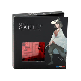 The Skull is a unique game by INSIDE3, featuring a striking black box with vibrant graphics. The front showcases an illustration of a character with a wolf mask and sword, hinting at the mysterious theme of the game. The box includes a clear window that reveals the intricate red puzzle pieces inside, designed to challenge and engage players with a blend of strategy and creativity.