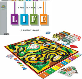 The Game of Life by Winning Moves, featuring a colorful board game layout with a winding path, houses, and play money. The box is brightly designed with the title 'The Game of Life' prominently displayed, indicating it's a family game suitable for ages 10 and up. Various components include player pieces, bills in different denominations, and a spinner for gameplay.