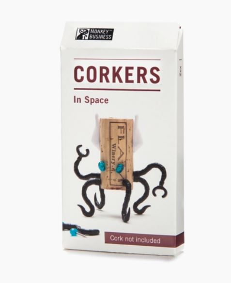 The box for a "corker" with pins stuck in a cork to make it look like an alien