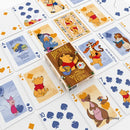 Winnie the Pooh card examples laid out in a grid with tuck box