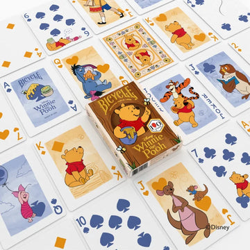 Winnie the Pooh card examples laid out in a grid with tuck box