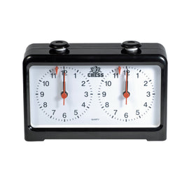 A classic analog chess clock displayed with two large white dials. Each dial shows numbers from 1 to 12, with red hands indicating the time. The black plastic casing adds a sleek touch, making it a perfect accessory for any chess game.