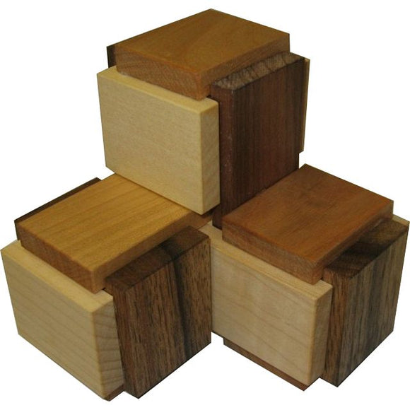 VINCO 3 Boxy Mechanical Puzzle featuring a collection of interlocking wooden blocks in various shades and finishes, designed to challenge and engage users in spatial reasoning and problem-solving skills.