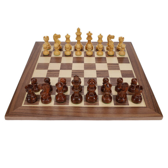 A beautifully crafted 12-inch walnut and maple chess set featuring intricately designed 2.75-inch chessmen. The board showcases alternating light and dark squares, enhancing the elegance of this classic game. Perfect for collectors and chess enthusiasts alike.