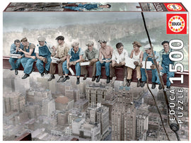 A vibrant 1500-piece jigsaw puzzle titled 'Breakfast in New York' by Educa, featuring iconic imagery of construction workers having lunch on a skyscraper beam high above the city, capturing a moment of camaraderie and nostalgia in an urban setting.