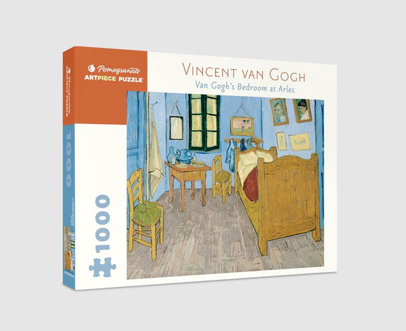 Pomegranate 1000-piece jigsaw puzzle featuring Vincent van Gogh's painting 'Van Gogh's Bedroom at Arles'. The box displays the iconic blue bedroom with a wooden bed, table, and vibrant decor in a high-quality design, perfect for art lovers and puzzle enthusiasts.