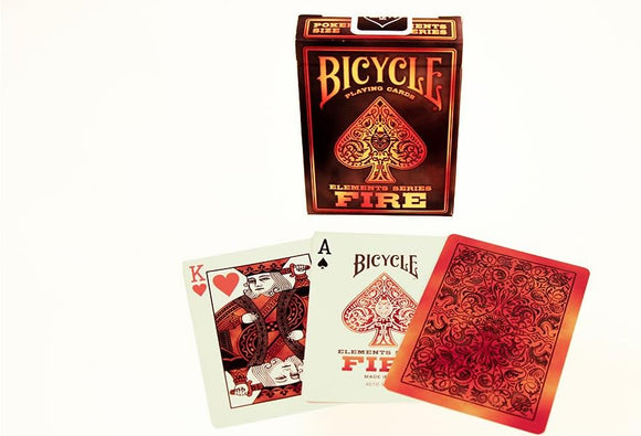 Bicycle Fire playing cards by US Playing Card Co. The design features vibrant red and black elements, showcasing the Ace of Spades and King of Hearts, along with the decorative card back. The packaging displays 'Bicycle Elements Series Fire' prominently.