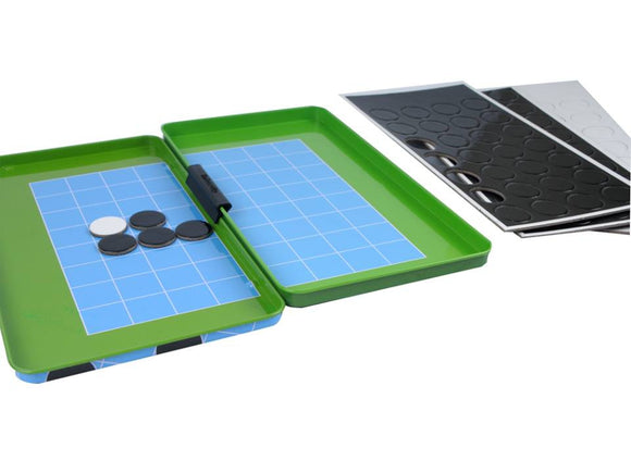 Magnetic Reversi game from Purple Cow, featuring a portable green tray with a blue grid board and black and white magnetic discs. The game is designed for two players to compete in flipping discs to their color. Includes multiple magnetic sheets.