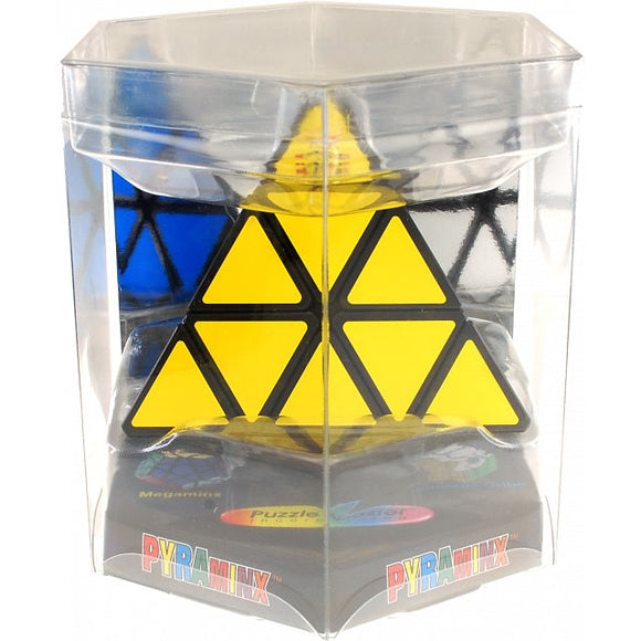 A clear packaging displays the Pyraminx mechanical puzzle by Mefferts. The puzzle features a yellow triangular centerpiece surrounded by black and blue triangular pieces, showcasing its unique geometric design and vibrant colors. The base of the package highlights the Pyraminx brand with colorful logos and images of the puzzle.