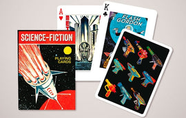A vintage deck of playing cards featuring a Science Fiction theme. The front of the deck showcases a rocket launching towards space with the title 'SCIENCE-FICTION' in bold letters. The cards include colorful illustrations of iconic characters and sci-fi gadgets, including Flash Gordon and various space guns, enhancing their unique and playful aesthetic.