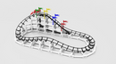 A colorful DIY roller coaster kit featuring tracks, a white base structure, and flags in red, green, yellow, and blue. Ideal for hands-on fun and creativity.