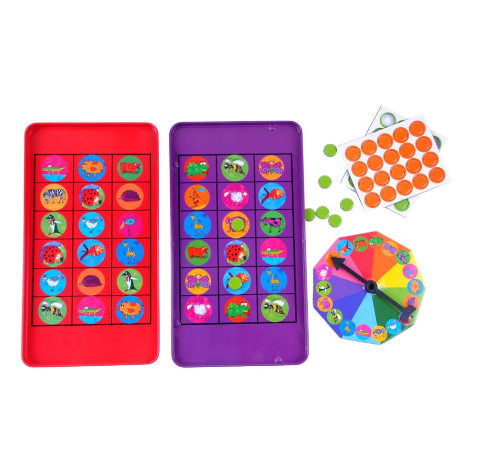 Magnetic Road Trip Bingo game by Purple Cow featuring two colorful magnetic boards in red and purple, each filled with playful animal graphics. The game includes a colorful spinning wheel, various magnetic markers in green and orange, and additional bingo cards, designed for family fun on road trips.