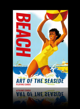 A vibrant playing cards deck titled 'Beach', featuring a bold graphic of a woman in a yellow swimsuit joyfully tossing a beach ball into the air. The background showcases a seaside scene with waves and a pier, evoking fun summer vibes and carefree beach activities.
