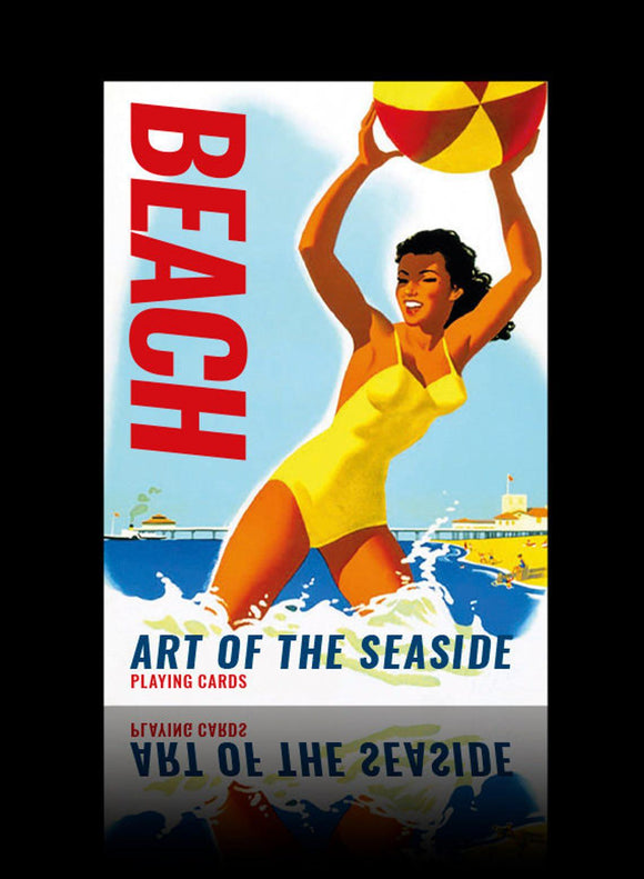 A vibrant playing cards deck titled 'Beach', featuring a bold graphic of a woman in a yellow swimsuit joyfully tossing a beach ball into the air. The background showcases a seaside scene with waves and a pier, evoking fun summer vibes and carefree beach activities.