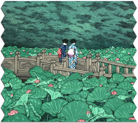 Beautiful jigsaw puzzle depicting two figures in traditional Japanese attire standing on a wooden bridge surrounded by lush green lotus leaves and pink lotus flowers in a serene pond setting, created by Artifact Wooden Puzzles.