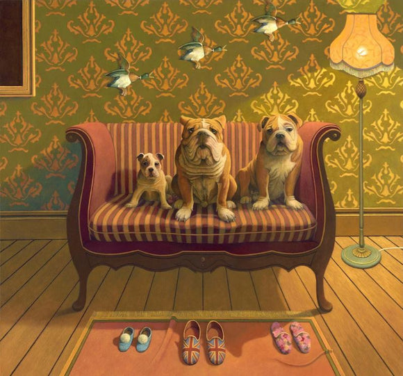 A charming jigsaw puzzle titled 'Creature Comforts' featuring three dogs—two bulldogs and one small dog—sitting on a striped couch. The background showcases a vintage wallpaper pattern and birds flying above. A cozy lamp and slippers on a rug add warmth to the scene.