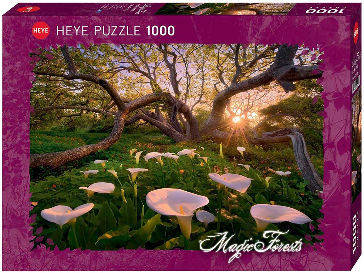 Magic Forests jigsaw puzzle by Heye, featuring a scenic calla lily clearing with beautiful trees and sunlight streaming through branches. The box showcases an enchanting forest landscape with vibrant greenery and delicate flowers.